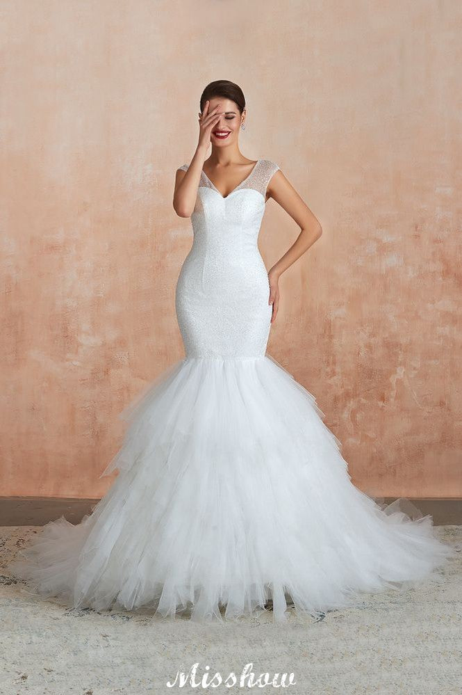 This elegant V-neck Tulle wedding dress with Beading,Sequined could be custom made in plus size for curvy women. Plus size Sleeveless Mermaid bridal gowns are classic yet cheap.