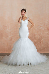 This elegant V-neck Tulle wedding dress with Beading,Sequined could be custom made in plus size for curvy women. Plus size Sleeveless Mermaid bridal gowns are classic yet cheap.