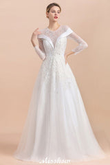 Looking for  in Tulle, A-line style, and Gorgeous Lace,Rhinestone work  MISSHOW has all covered on this elegant Modest White Beaded Appliques Wedding Dress Long Sleeve Floor Length Ball Gown